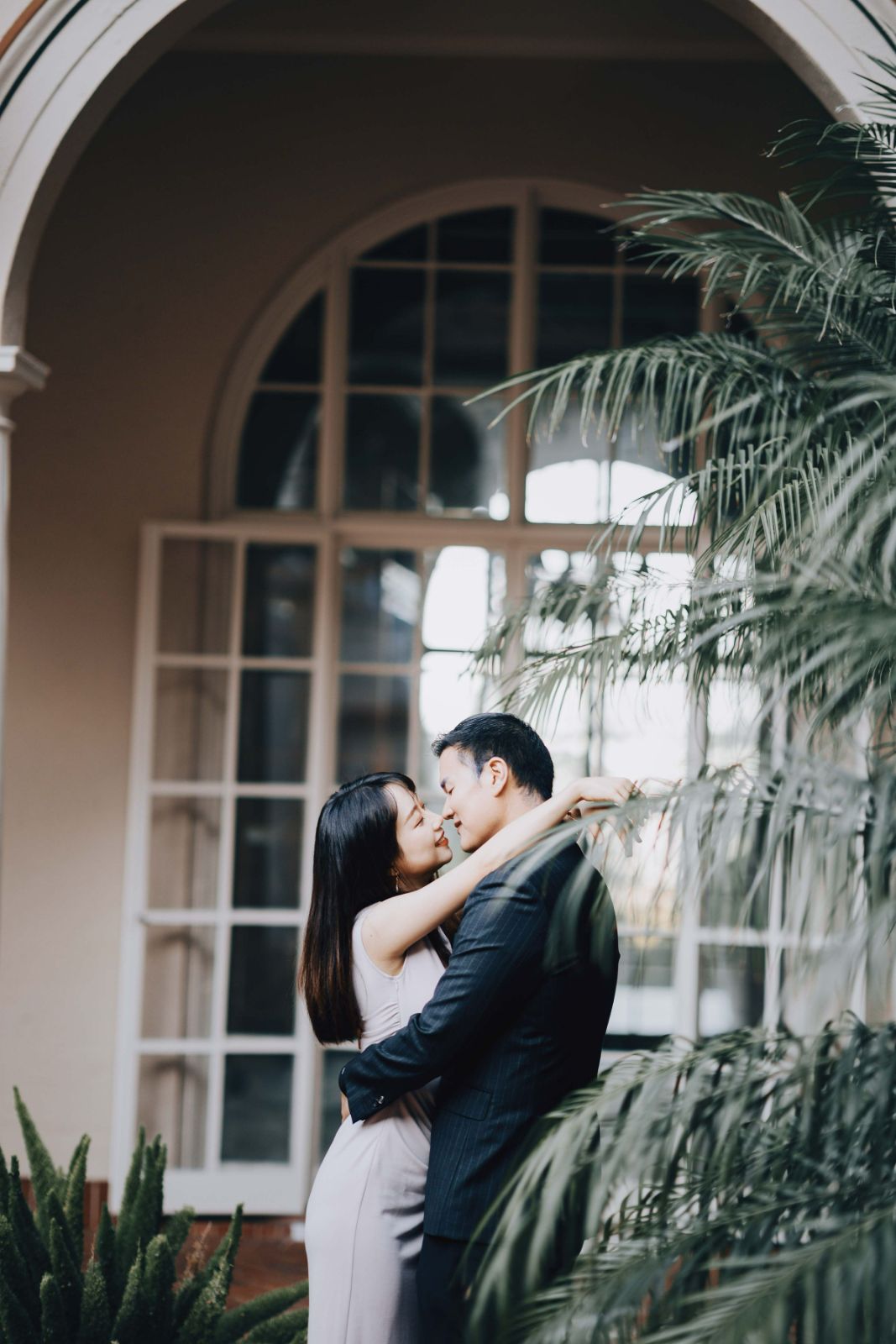 Couple posing among lush gardens at Montalvo Arts Center in Saratoga by SlowMo Studio