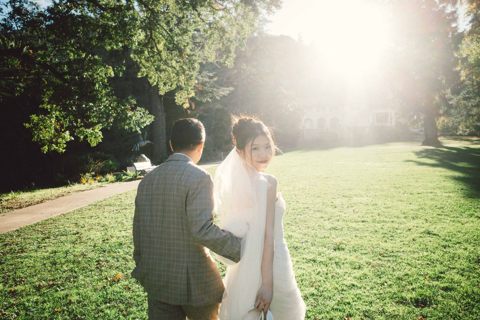 Tender couple embrace under golden light at Montalvo Arts Center by SlowMo Studio
